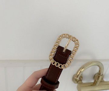 Stílusos női bőr öv fém díszítéssel