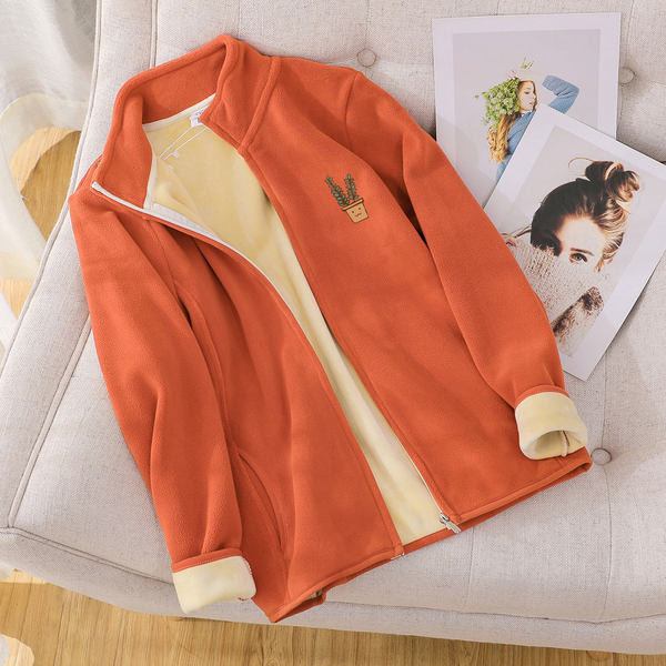 Női pulóver hímzéssel és cipzárral - különböző színekben