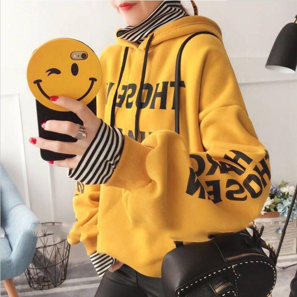 Női pulóver zöld és sárga feliratokkal