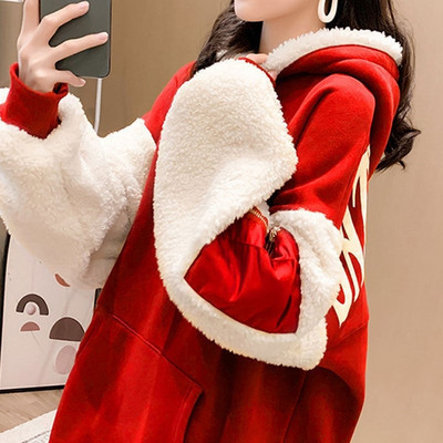 Női téli pulóver tollal és kapucnival