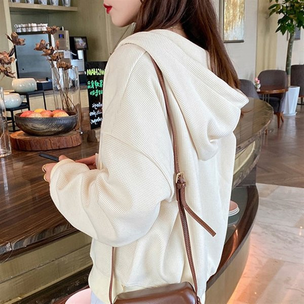 Női pulóver cipzárral és kapucnival több színben