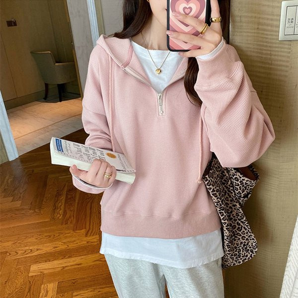 Női pulóver cipzárral és kapucnival több színben