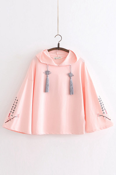 Női széles pulóver kapucnival és nyakkendővel