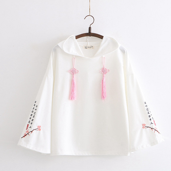 Női széles pulóver kapucnival és nyakkendővel