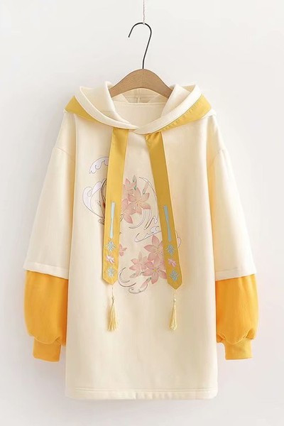 Női hosszú pulóver kapucnival és rátéttel