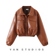 Női bőrdzseki gumival és zsebekkel