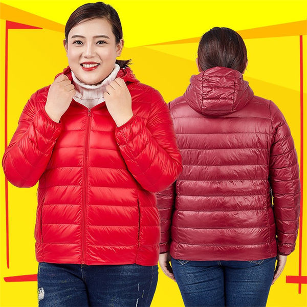 Egyszínű női kabát kapucnival és cipzárral