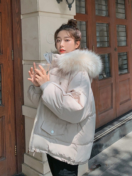 Női téli kabát kapucnival és gumival