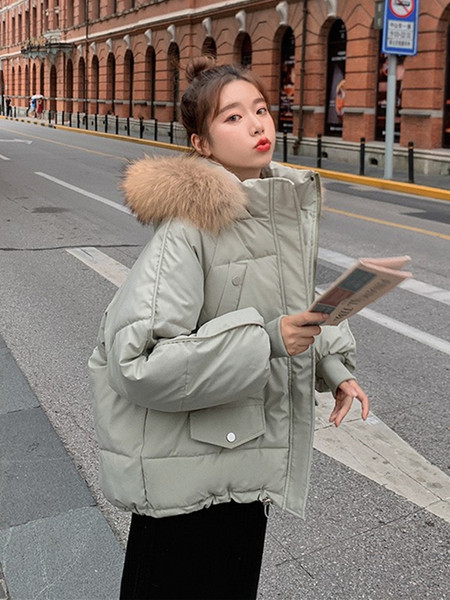 Női téli kabát kapucnival és gumival