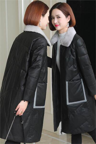 Műbőrből készült hosszú téli kabát tollas gallérral