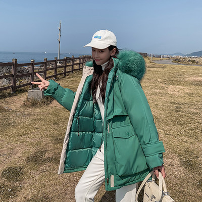 Női téli kabát zsebekkel - széles modell