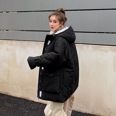 Női téli kabát zsebekkel - széles modell