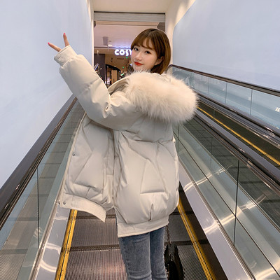 Bő női téli kabát kapucnival és zsebekkel