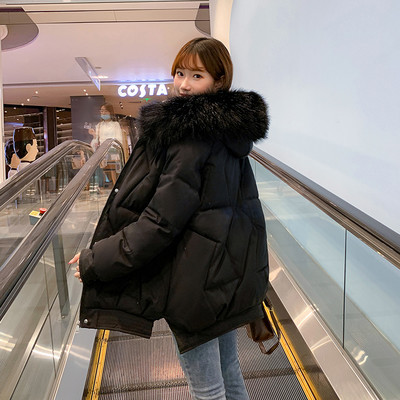 Bő női téli kabát kapucnival és zsebekkel