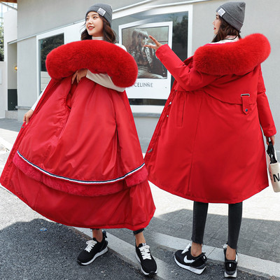 Hosszú női téli kabát fűzővel és kapucnival