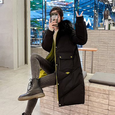 Hosszú női téli kabát tollas gallérral