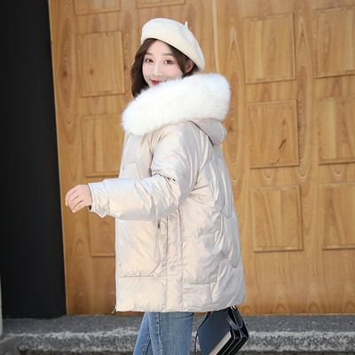 Alkalmi téli kabát kapucnival és mély zsebekkel nőknek