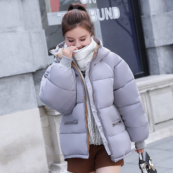 Őszi-téli női kabát cipzárral és kapucnival