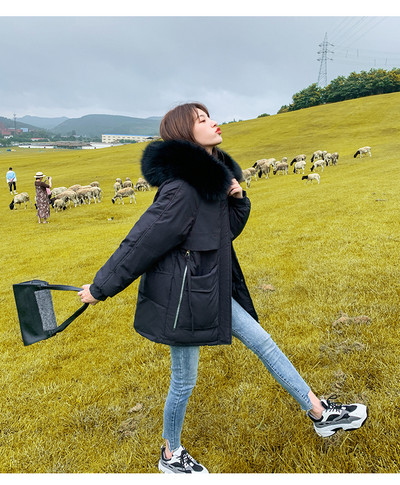 Női alkalmi kabát eco pehelyszínnel és mély zsebekkel