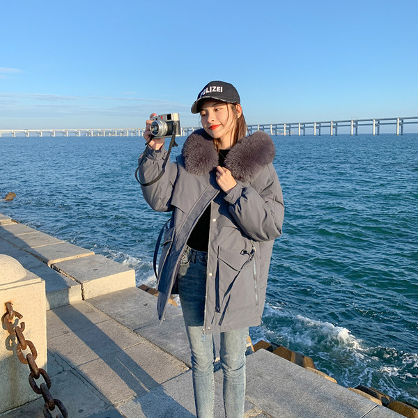 Női alkalmi kabát eco pehelyszínnel és mély zsebekkel