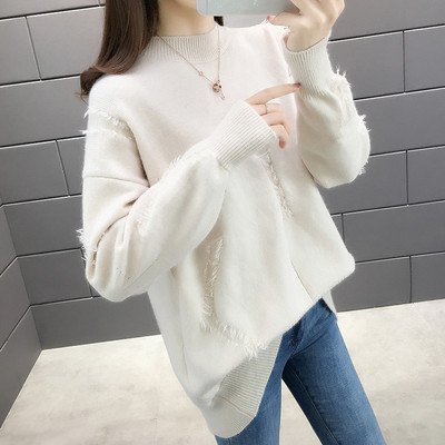 Női pulóver ovális nyakkivágással és rojtokkal