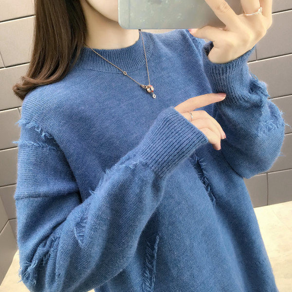 Női pulóver ovális nyakkivágással és rojtokkal