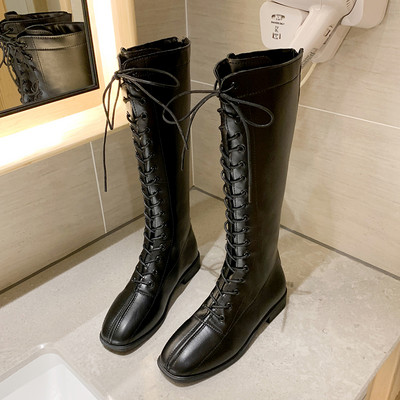 Női bőrcsizma műbőr nyakkendővel