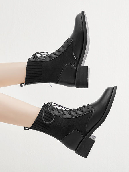 Női csizma fűzővel és gumival