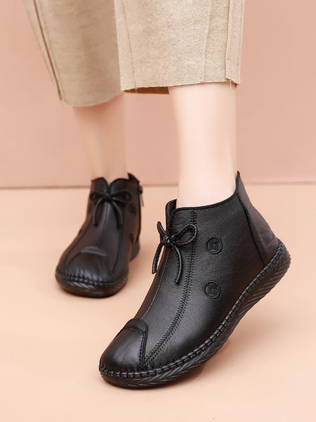 Pruuni ja musta paelaga naiste saapad