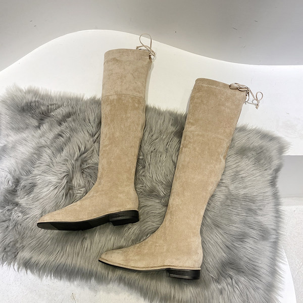 Naiste kunstnahast lipsudega saapad