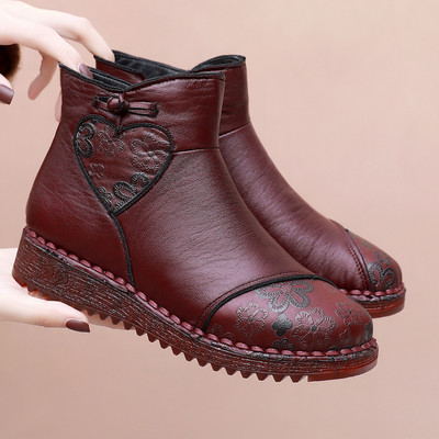 Lameda talla ja tikitud lilledega naiste saapad