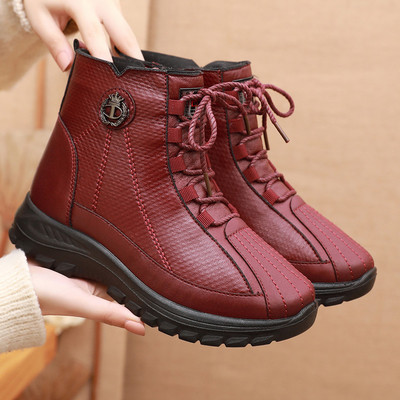 Öko bőrből készült női téli csizma fűzővel, fém díszítéssel