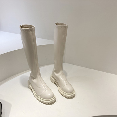 Naiste valge ja musta värvi nahast saapad - tasase tallaga