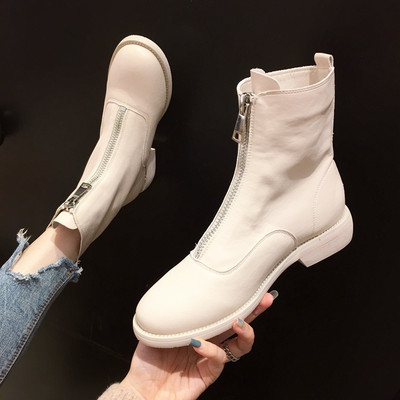 Naiste beeži ja musta värvi saapad, ees lukuga