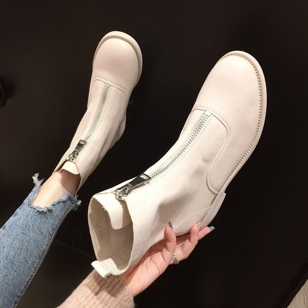 Naiste beeži ja musta värvi saapad, ees lukuga