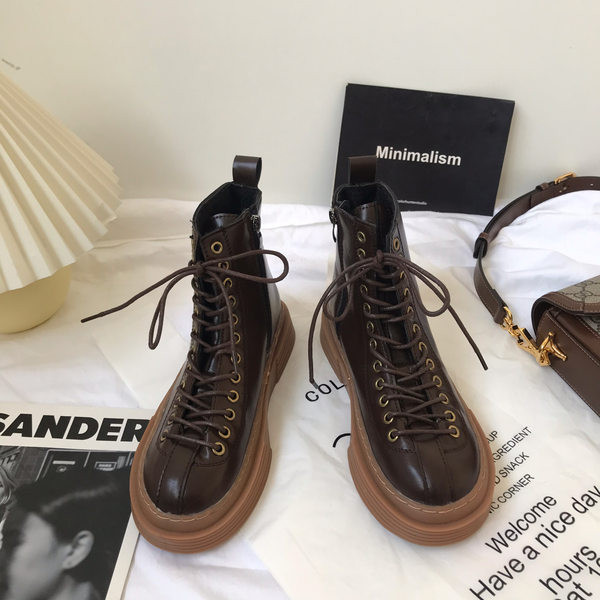 Öko-nahast valmistatud vabaaja naiste saapad pruunide paeltega