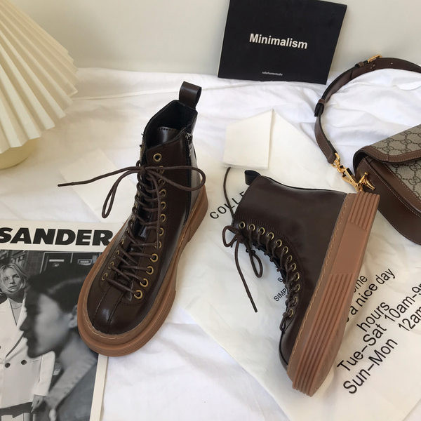 Öko-nahast valmistatud vabaaja naiste saapad pruunide paeltega