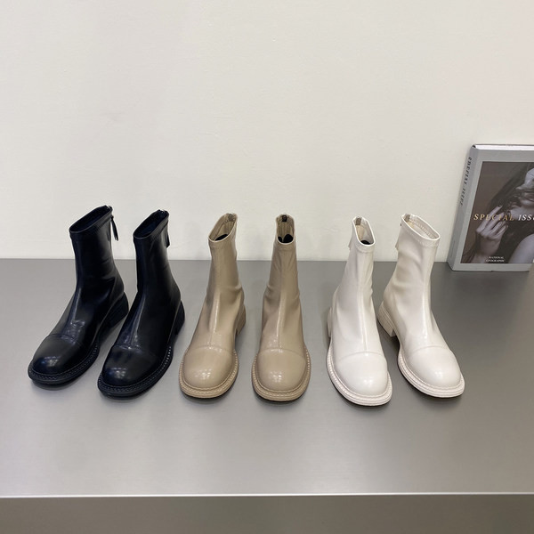 Naiste ühevärvilised lukuga kunstnahast saapad