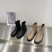 Kahes värvitoonis küljetõmblukuga naiste nahast saapad