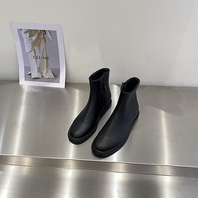 Kahes värvitoonis küljetõmblukuga naiste nahast saapad