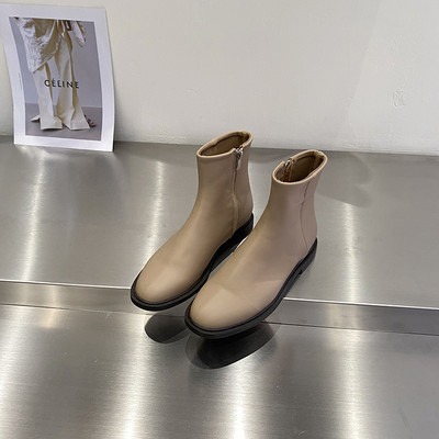 Kahes värvitoonis küljetõmblukuga naiste nahast saapad