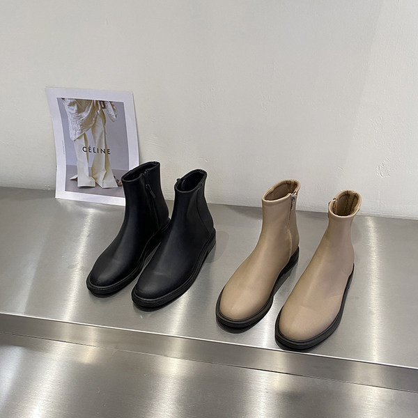 Kahes värvitoonis küljetõmblukuga naiste nahast saapad