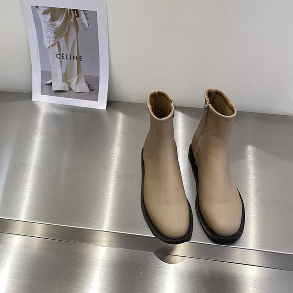 Kahes värvitoonis küljetõmblukuga naiste nahast saapad