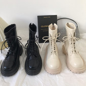 Naiste beeži ja musta paeltega nahast saapad